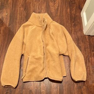All in motion Women’s tan colored fluffy jacket. Size medium.
